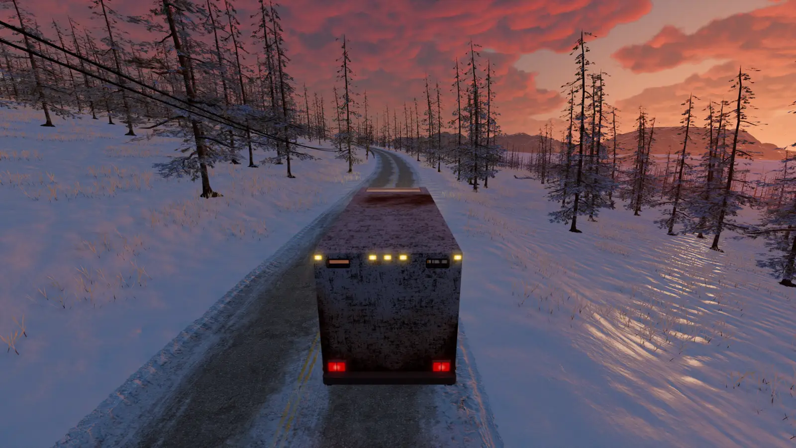 A school bus driving through snow in Nomad Drive